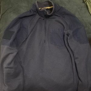5.11 tactical, size XL, 1/4 zip up in navy blue and has a front pocket